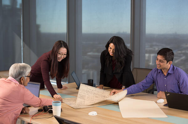 Colleagues collaborating in a board room