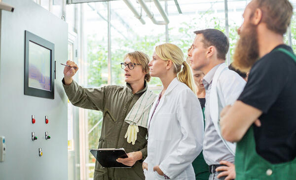 People in lab looking at screen