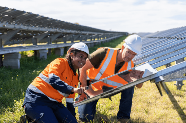 2 technicians working on solar panels
