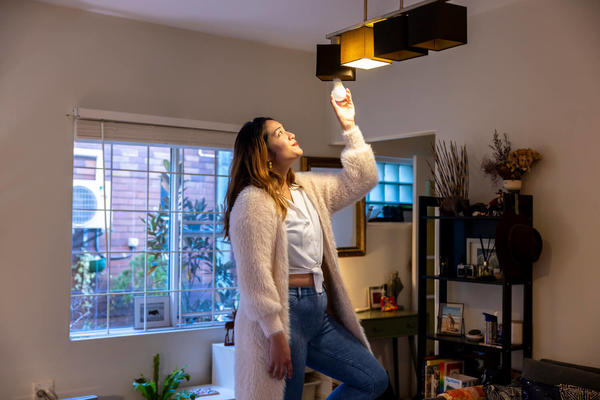 A renter changing a lightbulb